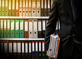 Colombian Lawyer Holding Data Files for Regulatory Services
