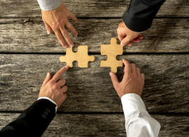 Business People Joining Forces in Merger and Acquisitions